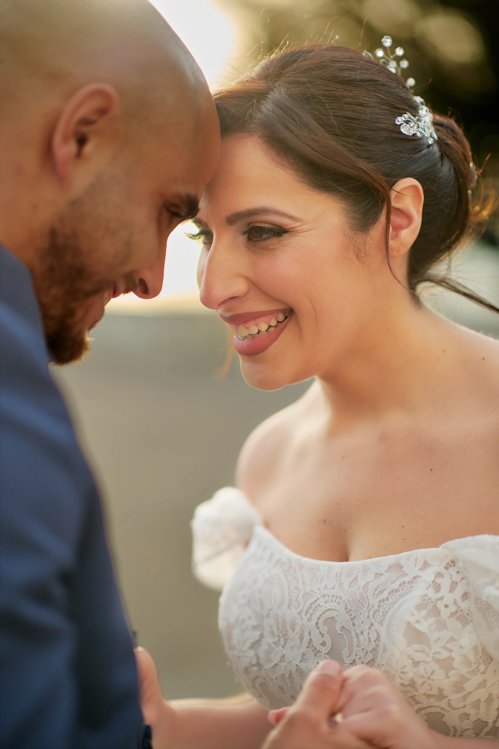 Rosa smiling towards Ciro during their wedding portraits at the Belvedere in Agerola.
