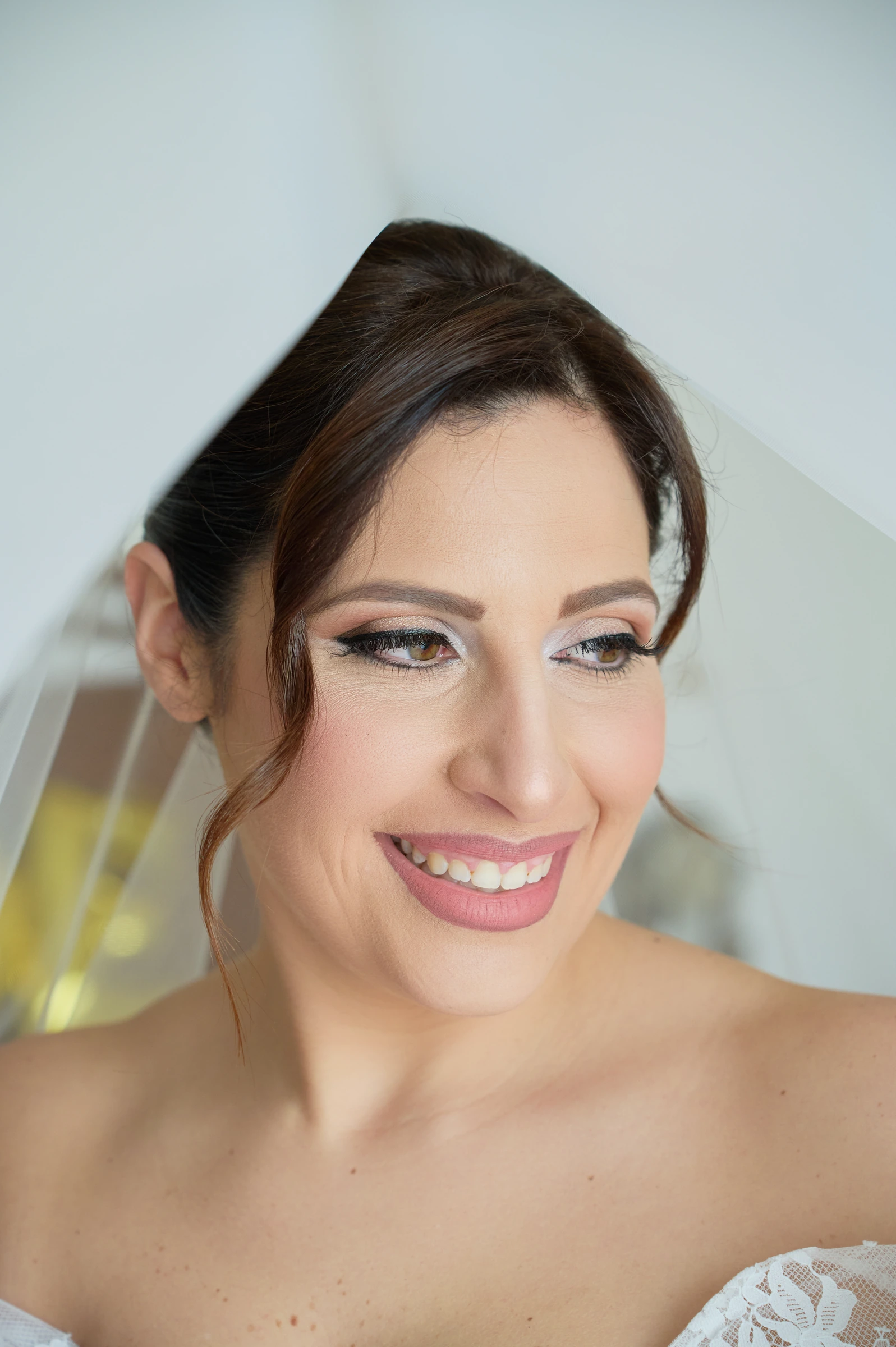 Rosa smiling beneath her bridal veil before the ceremony in Gragnano.