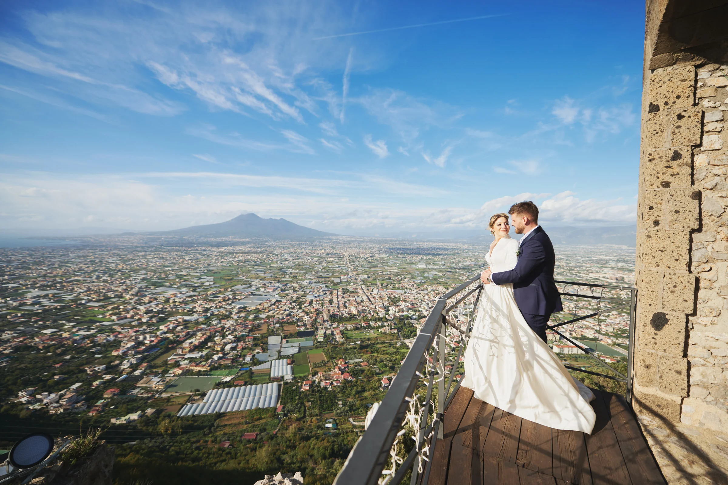 Matteo and Clementina on a panoramic terrace at Lettere Castle overlooking Mount Vesuvius.