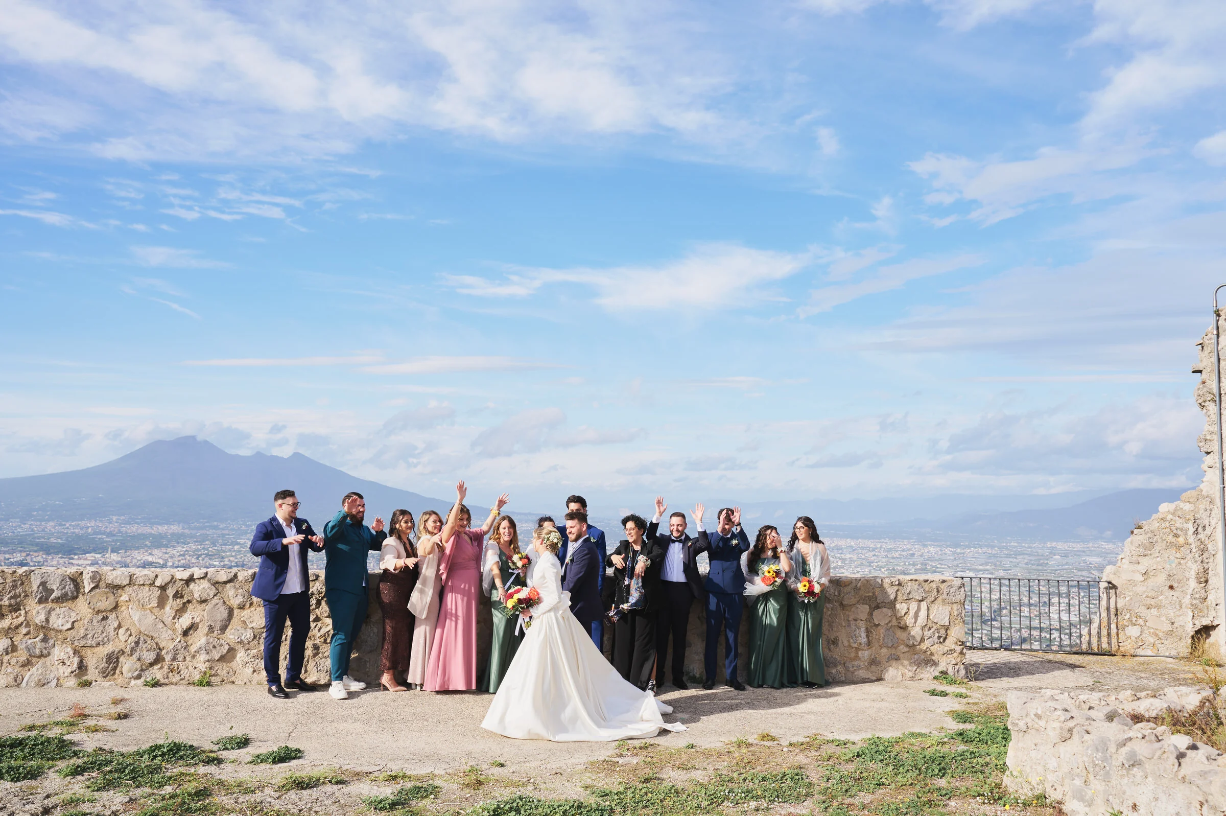 Matteo and Clementina with their wedding guests overlooking Mount Vesuvius in Gragnano.